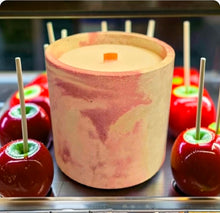 Load image into Gallery viewer, Candle in a decorative container with candy apples around it