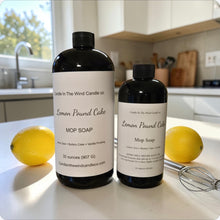 Load image into Gallery viewer, Two bottles of Lemon Pound Cake mop soap on a kitchen counter with lemons and a whisk.