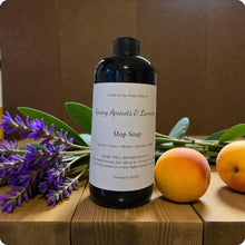 Load image into Gallery viewer, Bottle of mop soap with lavender and apricots on a wooden surface