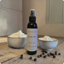 Load image into Gallery viewer, Vanilla Whip spray bottle with vanilla beans and cream on a wooden surface