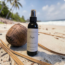 Load image into Gallery viewer, Bottle of 'Baja' spray on a sandy beach with a coconut and dried leaves.
