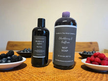 Load image into Gallery viewer, Two bottles of Blackberry &amp; Saffron MOP Soap on a table with berries  around 16oz &amp; 32oz bottles.
