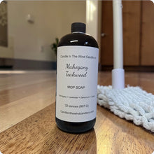 Load image into Gallery viewer, Bottle of Mahogany Teakwood Mop Soap on a wooden floor with cleaning tools in the background.
