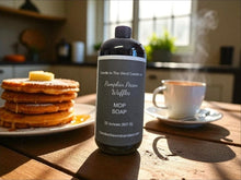 Load image into Gallery viewer, Bottle of pumpkin pecan waffles soap on a table with pancakes and coffee
