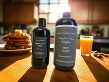Load image into Gallery viewer, Two bottles of 'Pumpkin Pecan Waffles' mop soap on a wooden table with waffles and juice in the background.
