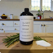 Load image into Gallery viewer, Bottle of Sea Salt &amp; Rosemary MOP Soap on a wooden surface with kitchen background
