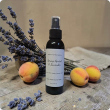Load image into Gallery viewer, Spray bottle labeled 'Spring Apricot &amp; Lavender' with apricots and lavender on a wooden surface.
