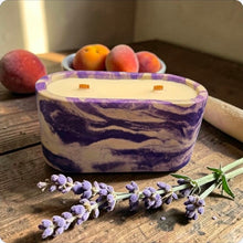 Load image into Gallery viewer, Marble-patterned concrete candle with apricots and lavender on a wooden surface
