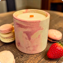 Load image into Gallery viewer, Marbled concrete candle with macarons and a strawberry on a wooden surface
